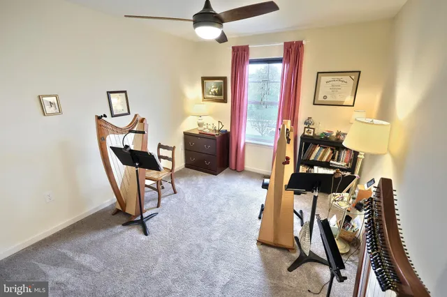 a bathroom with a toilet a sink and a mirror