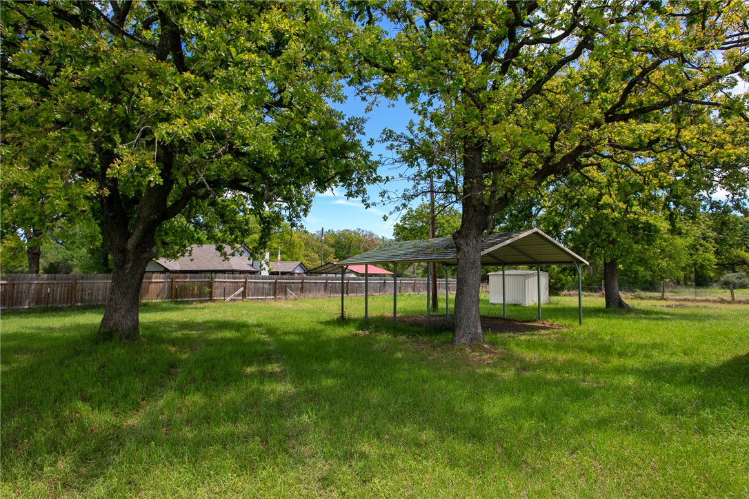 11459 Winstead Lane Calvert, TX 77837 - Photo 27 of 37 a view of house with a big yard and large trees