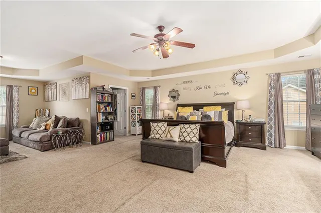 a living room with furniture and white walls