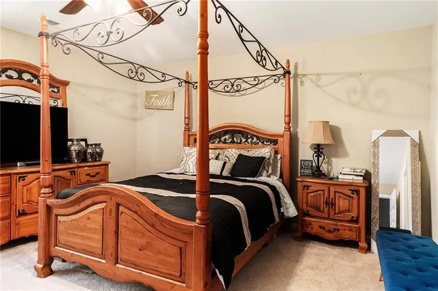 a bedroom with two beds and a flat screen tv