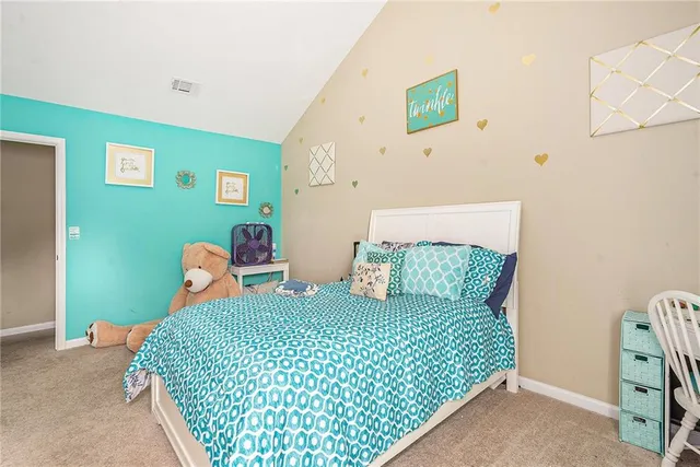 a bedroom with a bed and furniture