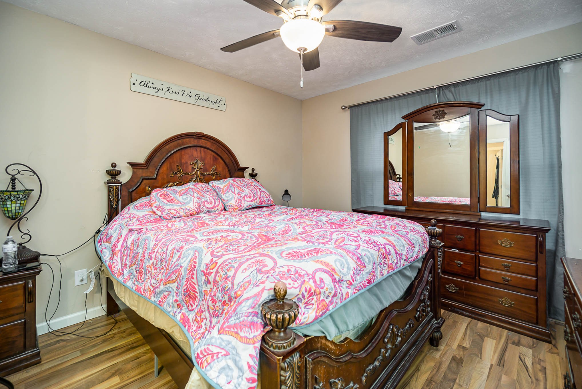 1679 Eno Road Dickson, TN 37055 - Photo 13 of 36 a bedroom with a bed and dresser with mirror