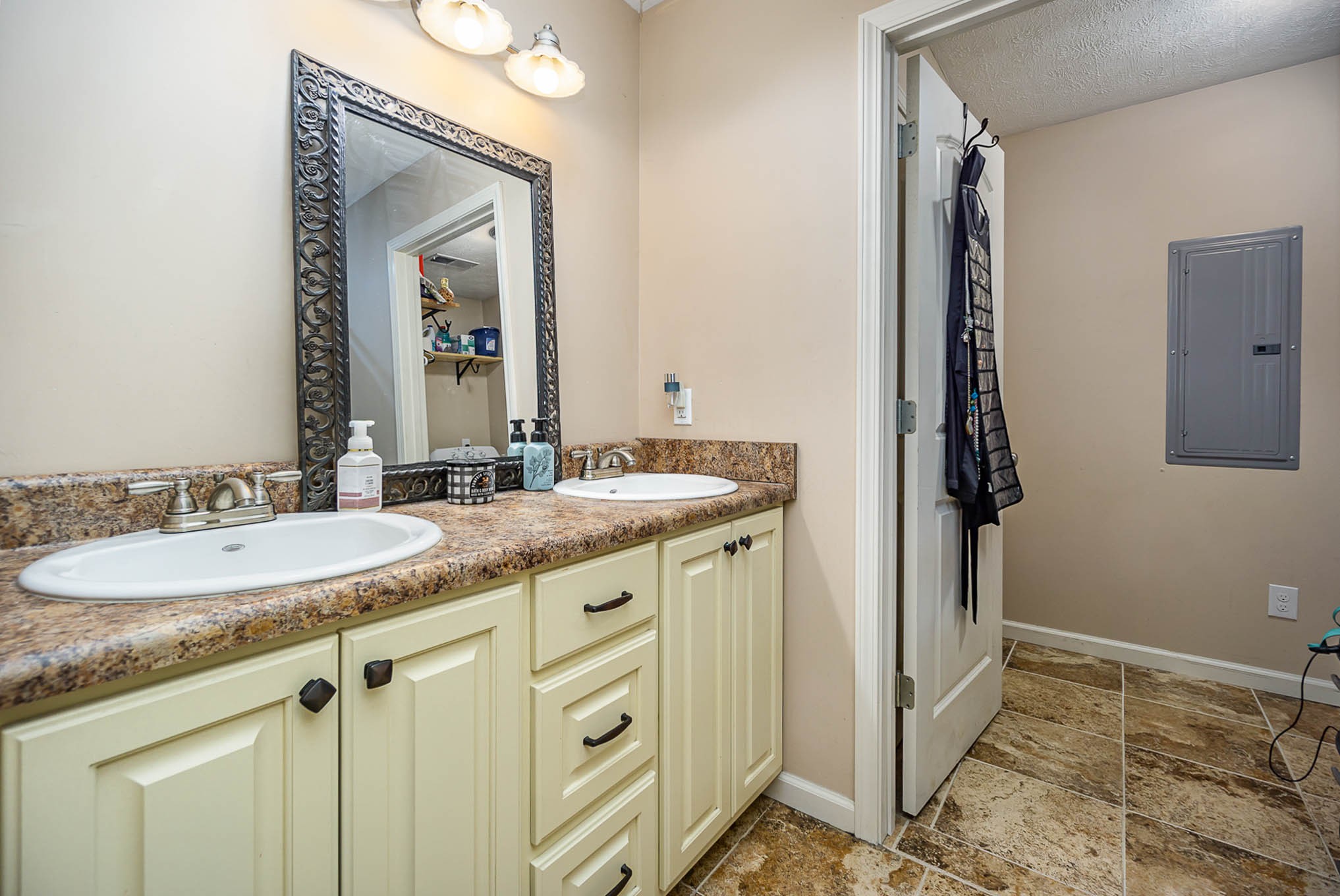 1679 Eno Road Dickson, TN 37055 - Photo 14 of 36 a bathroom with a granite countertop sink and a mirror