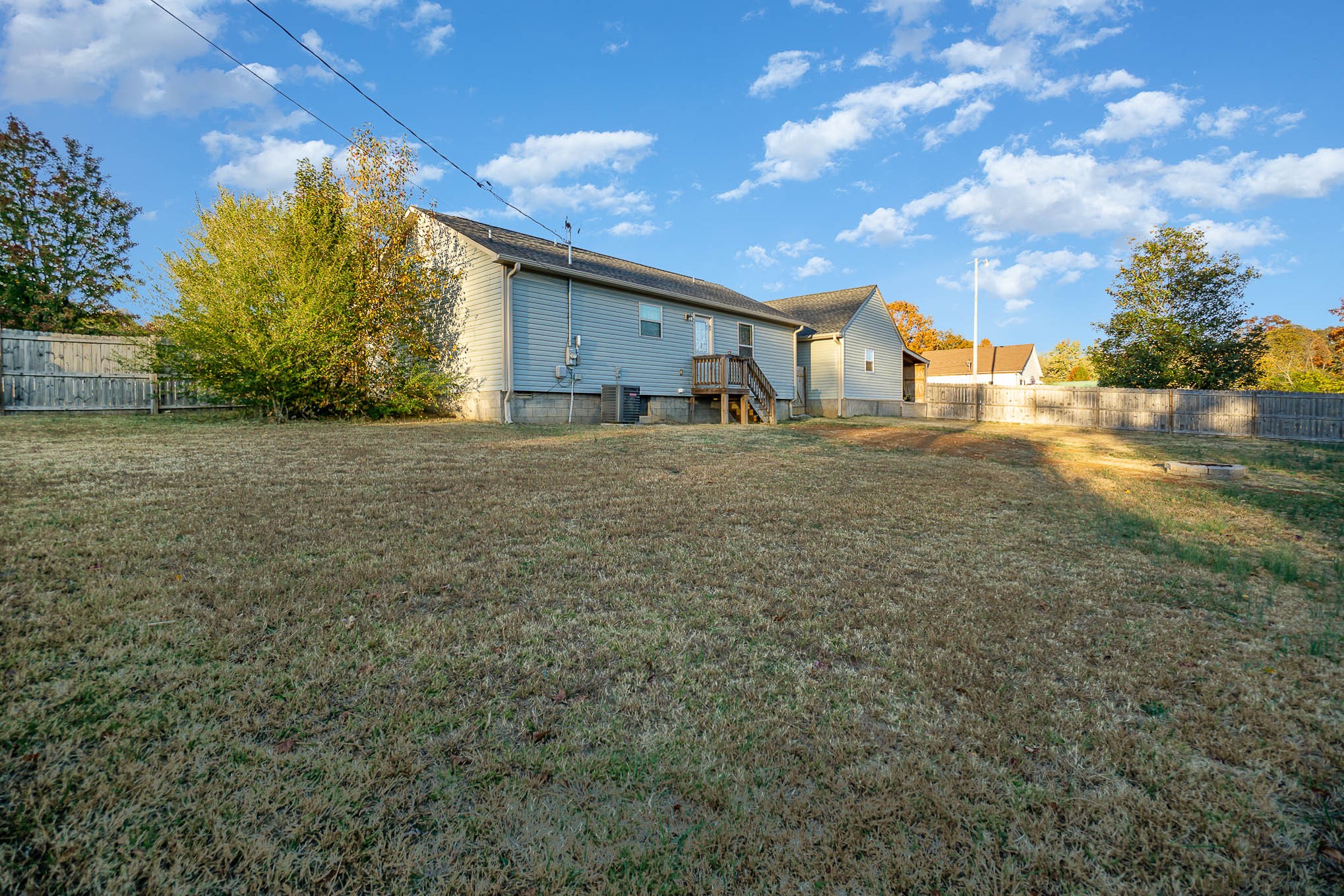 1679 Eno Road Dickson, TN 37055 - Photo 20 of 36 a view of a house with a backyard