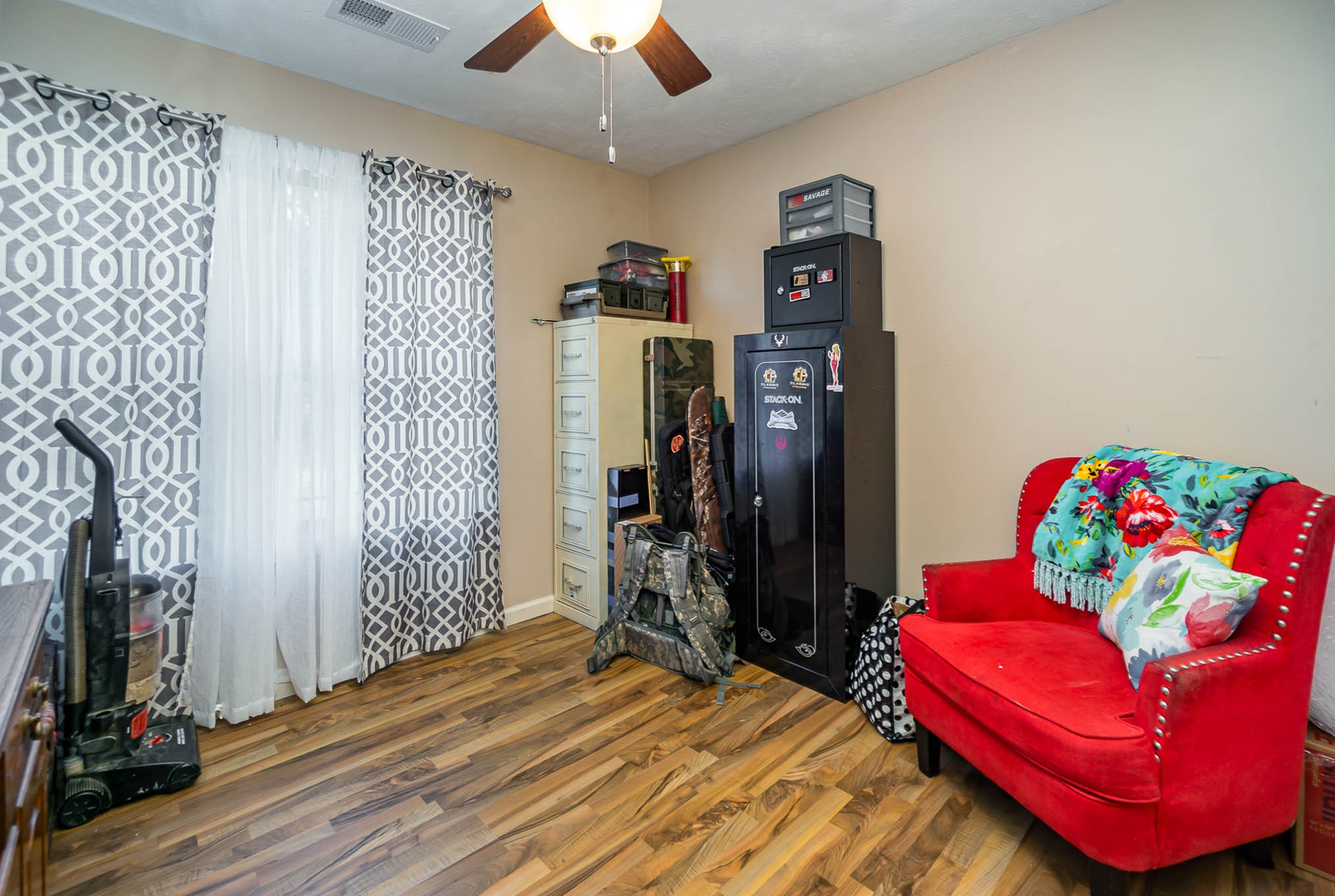 1679 Eno Road Dickson, TN 37055 - Photo 22 of 36 a bedroom with a bed and a chandelier