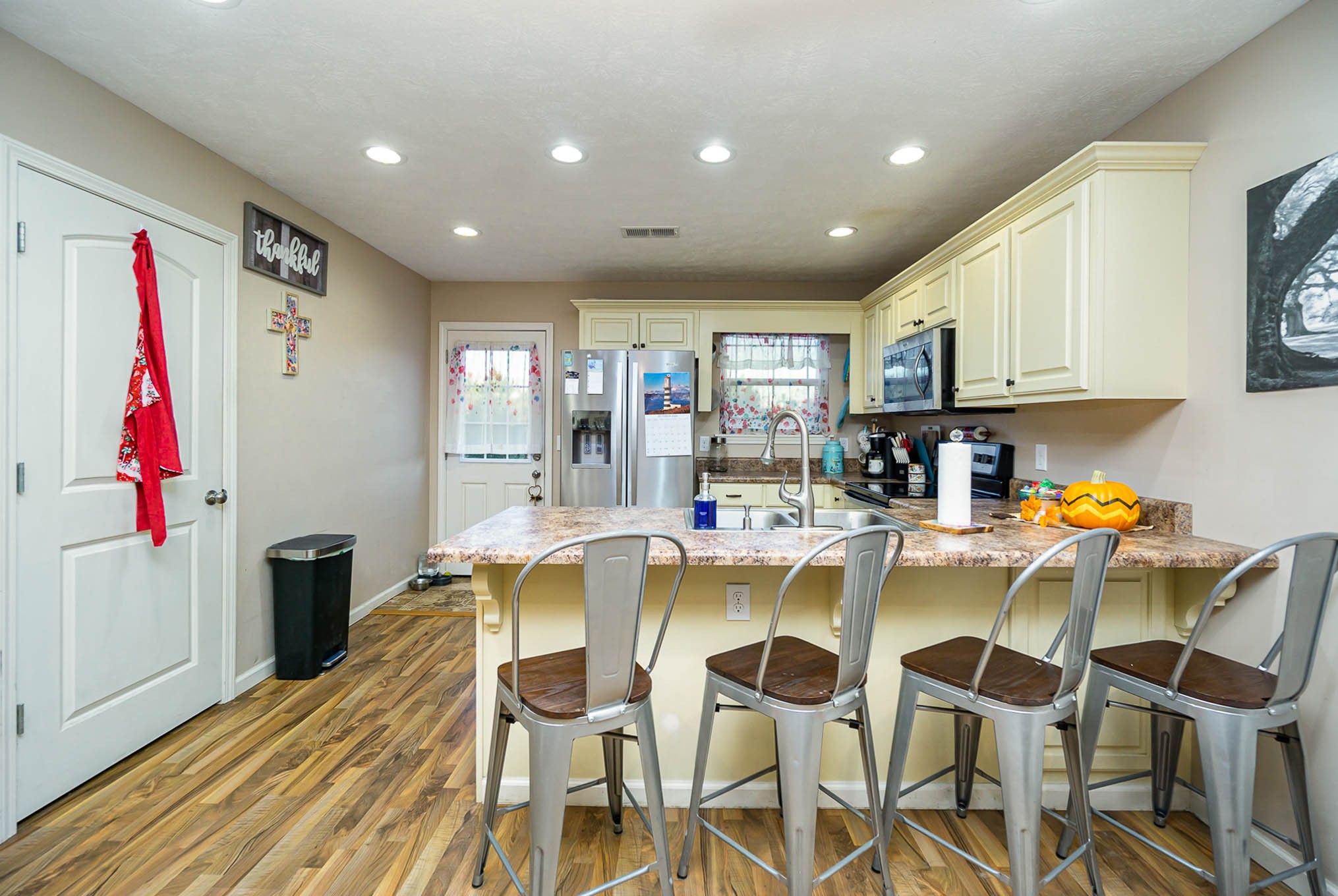 1679 Eno Road Dickson, TN 37055 - Photo 6 of 36 a view of a dining room with furniture and wooden floor