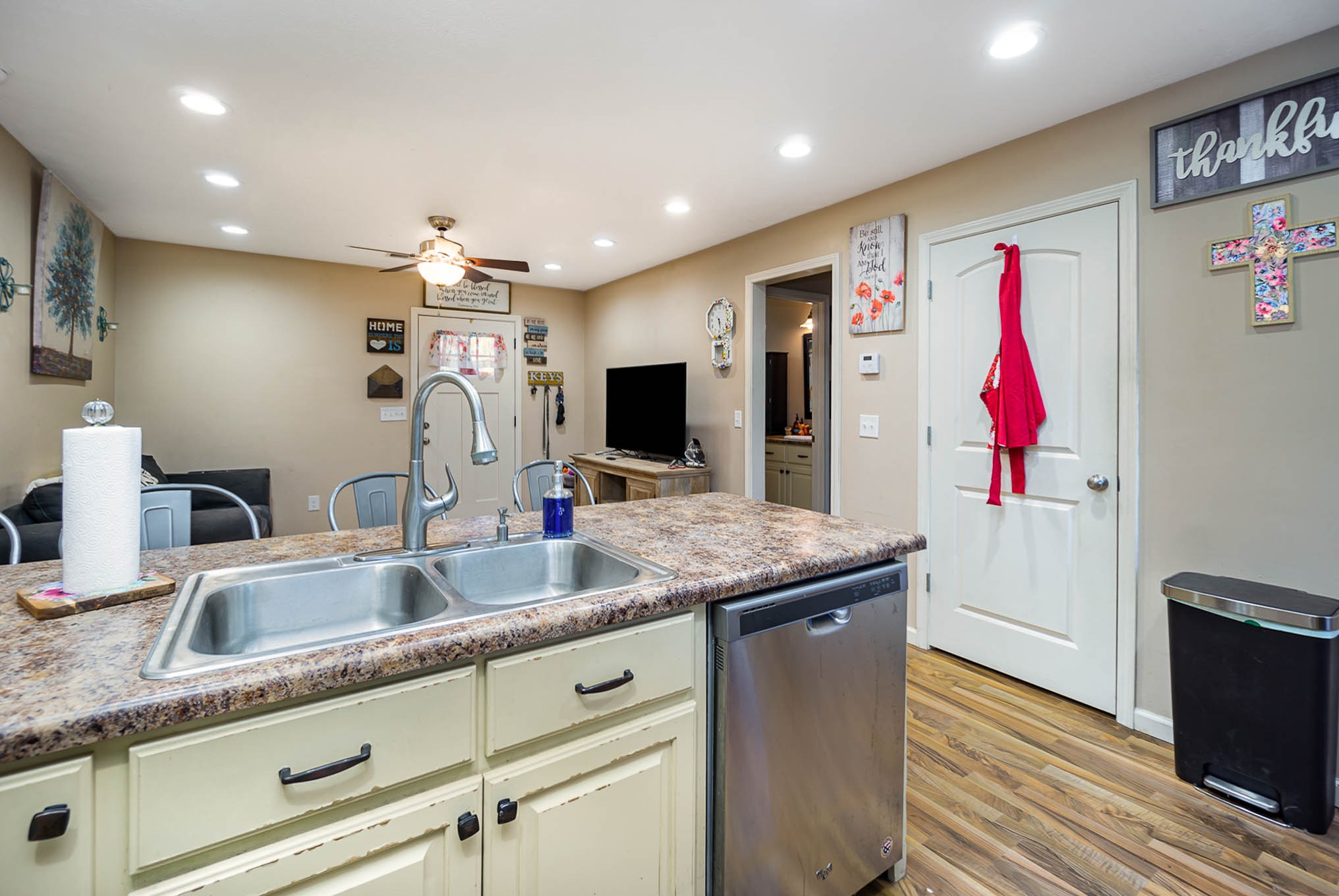 1679 Eno Road Dickson, TN 37055 - Photo 9 of 36 a kitchen with kitchen island granite countertop a sink and a refrigerator