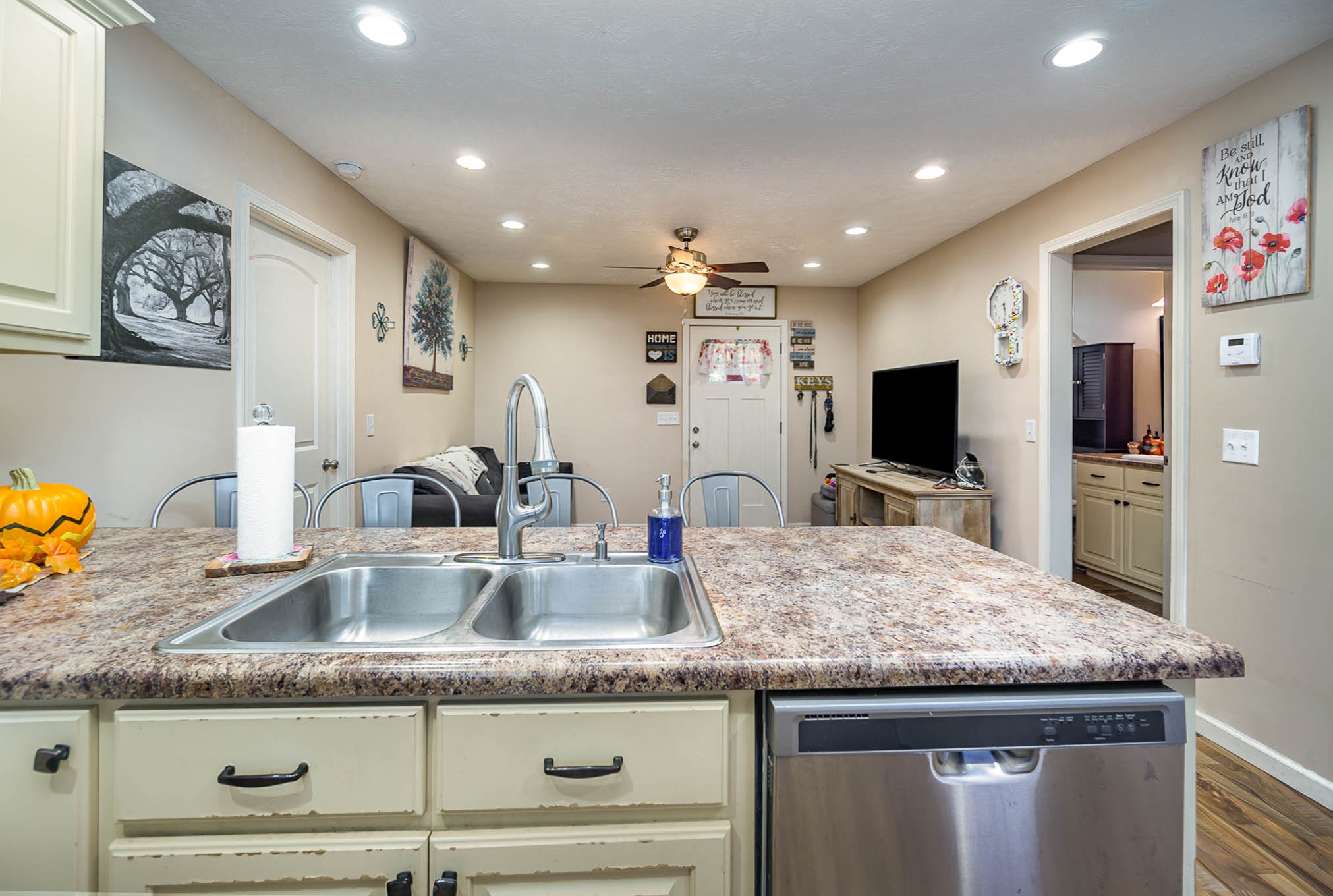 1679 Eno Road Dickson, TN 37055 - Photo 10 of 36 a kitchen with granite countertop kitchen island stainless steel appliances a sink and a refrigerator