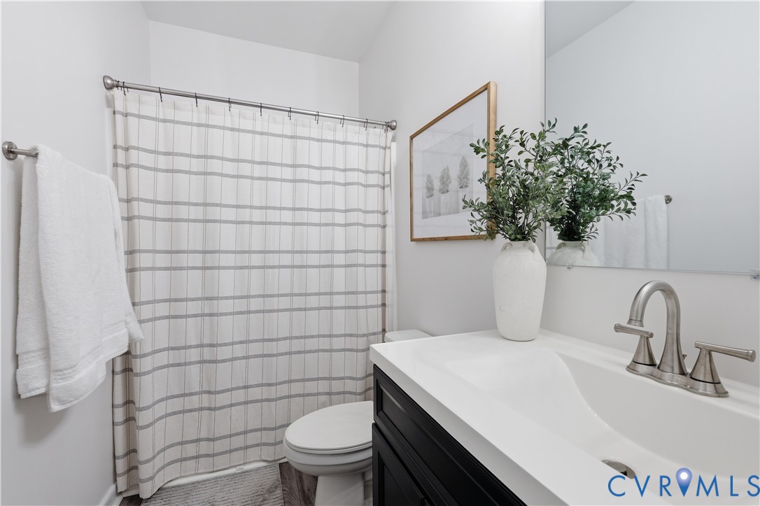 235 Stoney Point Road Cumberland, VA 23040 - Photo 32 of 35 a bathroom with a sink a toilet and shower