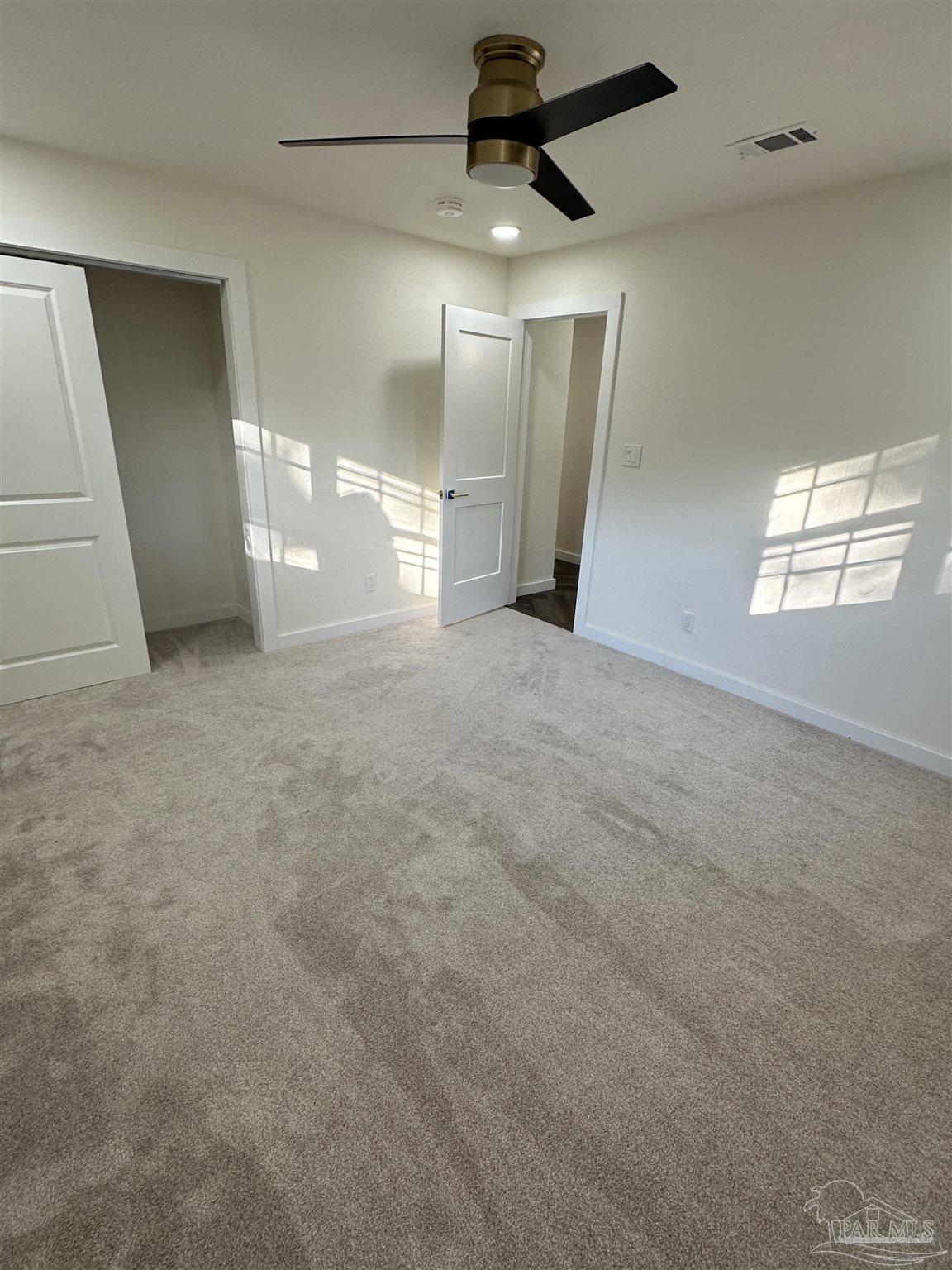 5520 Jones Street Milton, FL 32570 - Photo 11 of 16 an empty room with windows and entrance