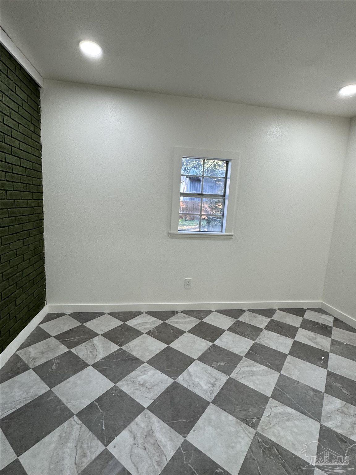 5520 Jones Street Milton, FL 32570 - Photo 13 of 16 a view of a black and white checkered floor