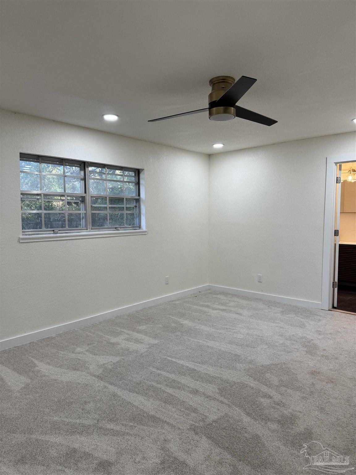 5520 Jones Street Milton, FL 32570 - Photo 9 of 16 a view of an empty room with a window