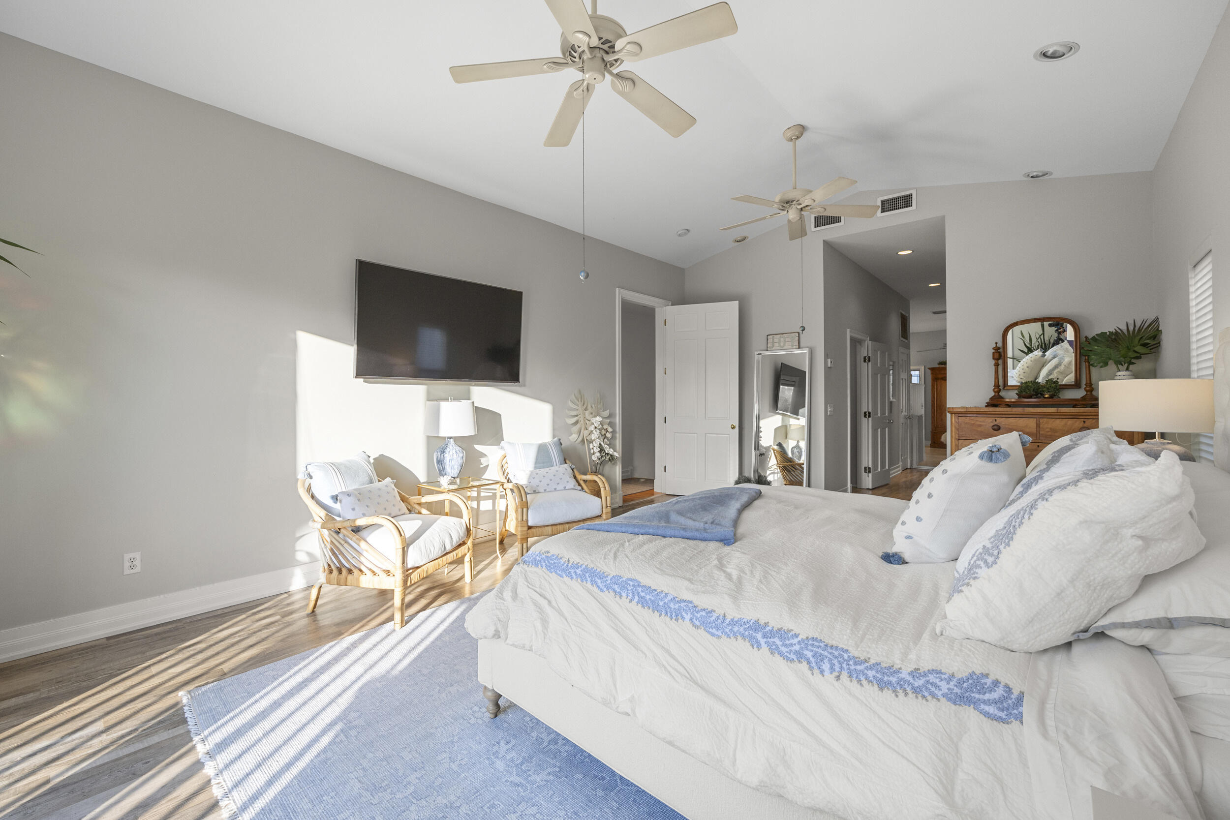 122 Lighthouse Drive Jupiter Inlet Colony, FL 33469 - Photo 40 of 84 a bedroom with a bed and a flat screen tv