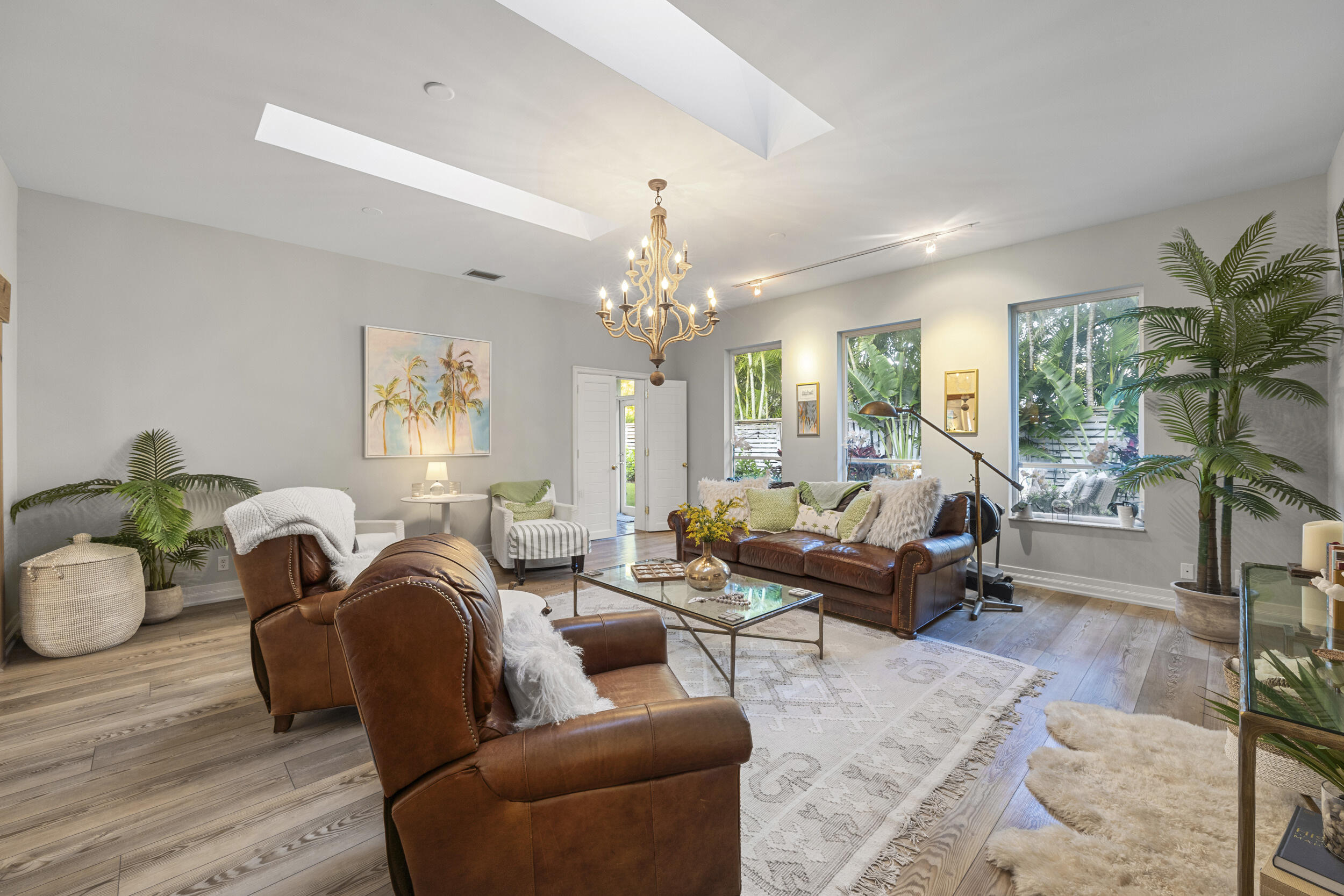122 Lighthouse Drive Jupiter Inlet Colony, FL 33469 - Photo 10 of 84 a living room with furniture or chandelier and a wooden floor