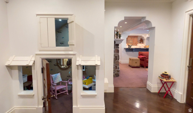 426 West Center Street Parowan, UT 84761 - Photo 57 of 107 Hardwood-style flooring extends into an arched doorway featuring stone-clad columns