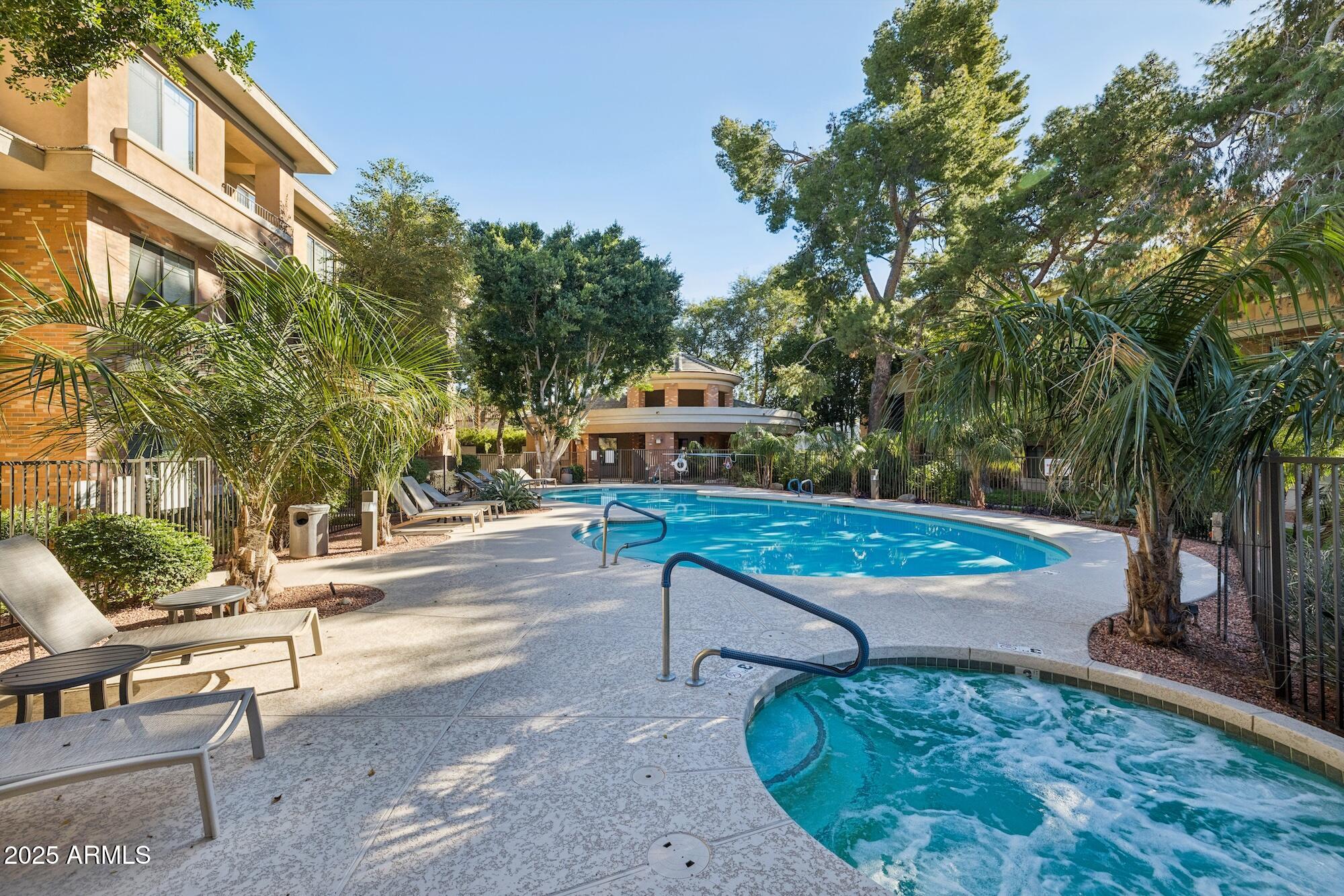 2989 North 44th Street, Unit 2023 Phoenix, AZ 85018 - Photo 14 of 20 a view of a backyard with a bench