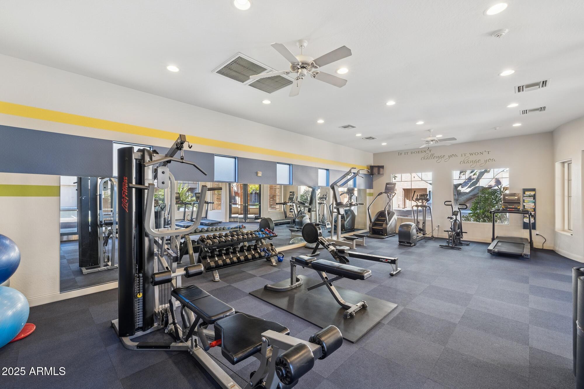 2989 North 44th Street, Unit 2023 Phoenix, AZ 85018 - Photo 16 of 20 a living room with furniture and white walls