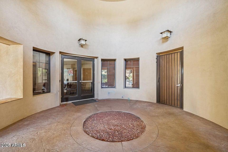 2989 North 44th Street, Unit 2023 Phoenix, AZ 85018 - Photo 17 of 20 wooden floor and window in an empty room