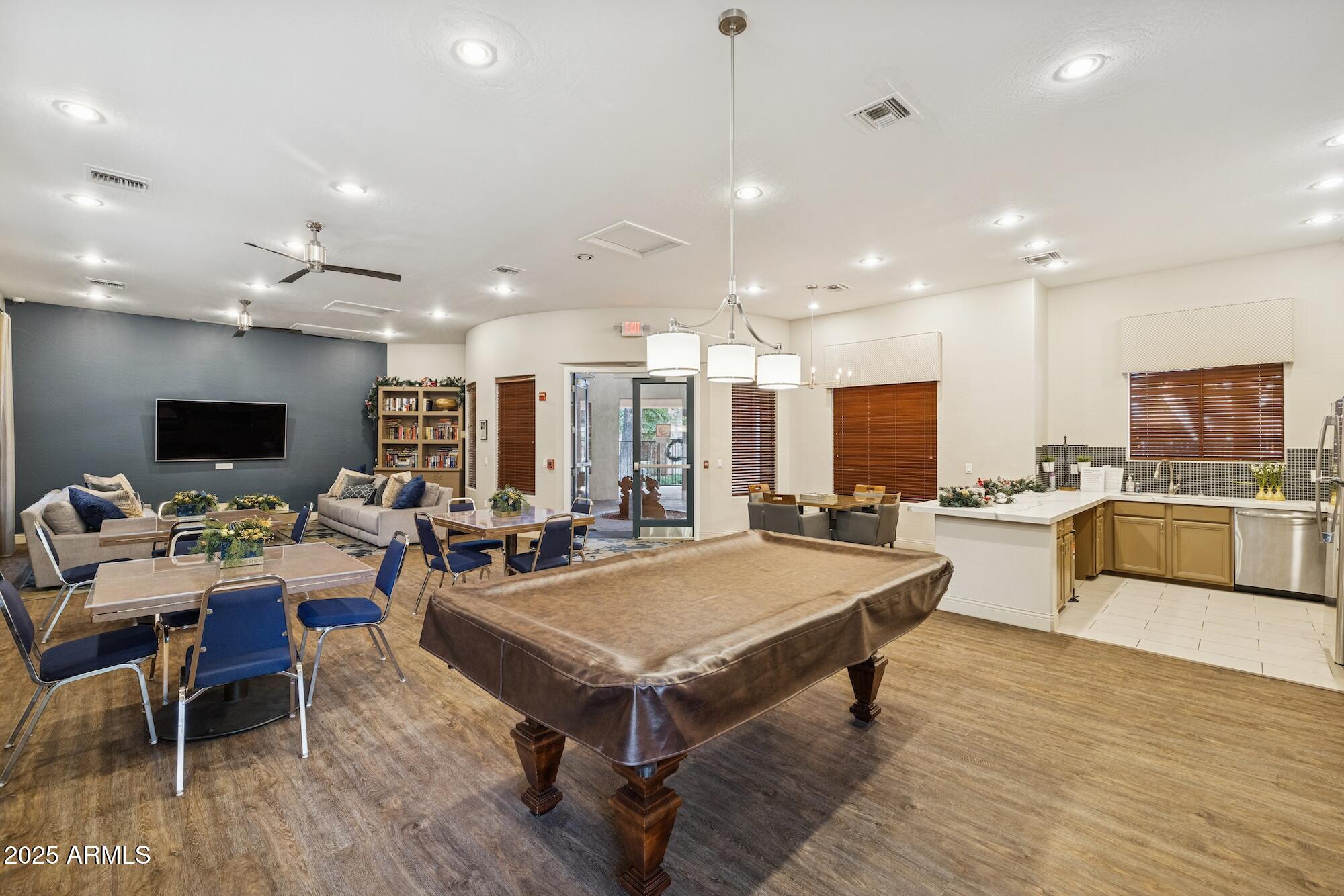 2989 North 44th Street, Unit 2023 Phoenix, AZ 85018 - Photo 18 of 20 a room with stainless steel appliances lots of furniture and view kitchen