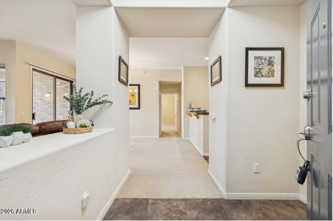 2989 North 44th Street, Unit 2023 Phoenix, AZ 85018 - Photo 2 of 20 a view of a hallway with a outdoor space