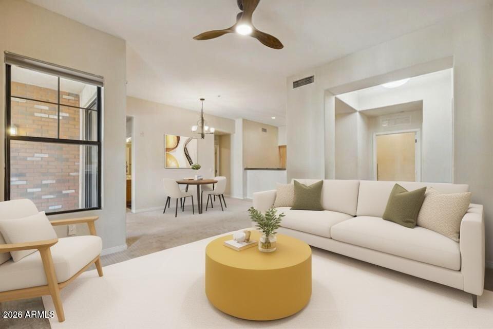 2989 North 44th Street, Unit 2023 Phoenix, AZ 85018 - Photo 6 of 20 a living room with furniture and a large window