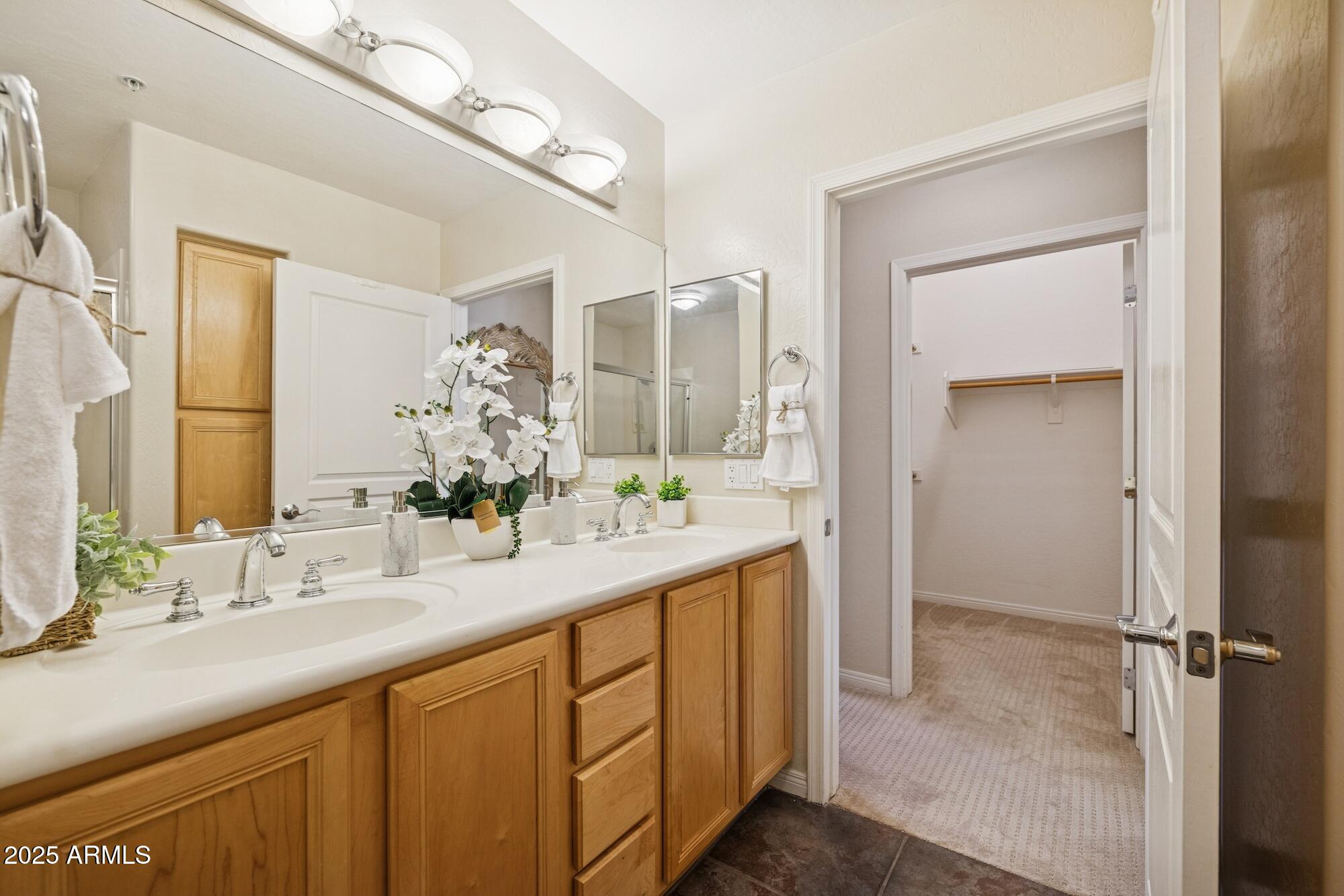 2989 North 44th Street, Unit 2023 Phoenix, AZ 85018 - Photo 8 of 20 a bathroom with a sink and a mirror