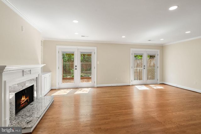 a view of a kitchen center island and a chandelier