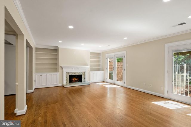 a kitchen with stainless steel appliances granite countertop a refrigerator a stove and a sink