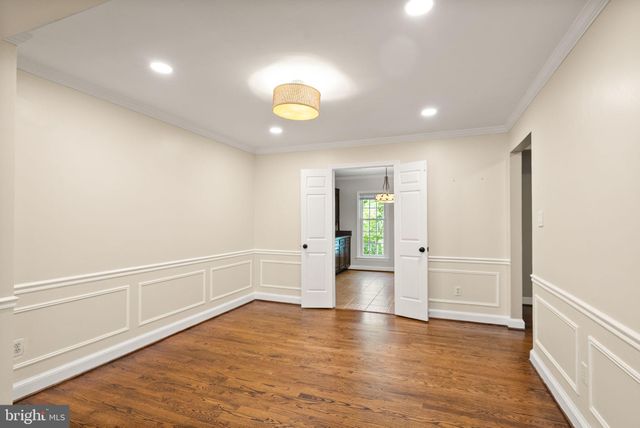 a kitchen with a refrigerator and a sink