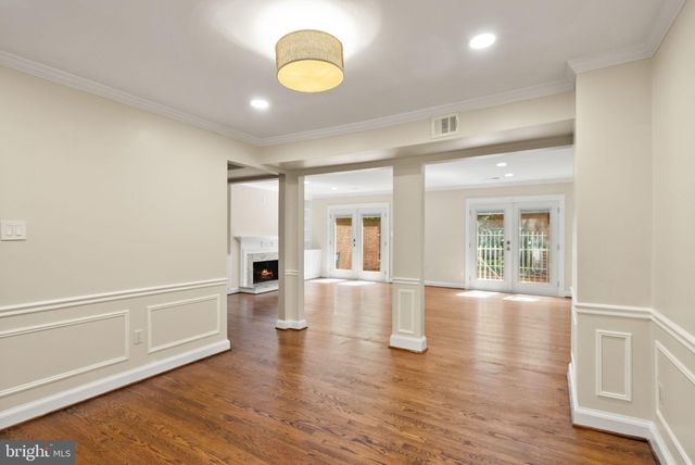 a bathroom with a granite countertop toilet and a sink