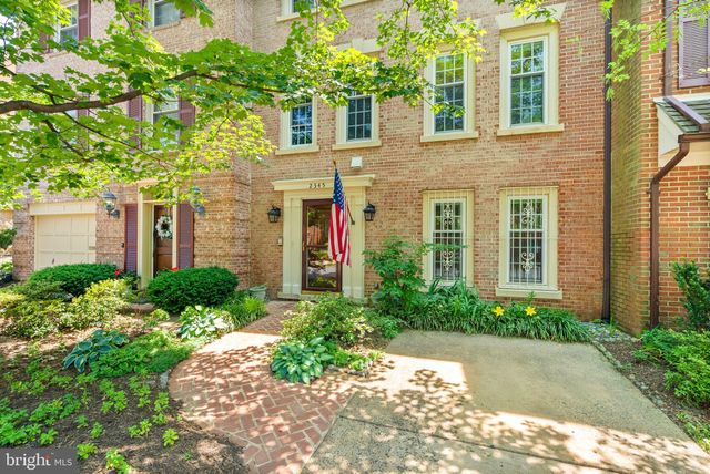 a front view of a house with a yard and a staircase