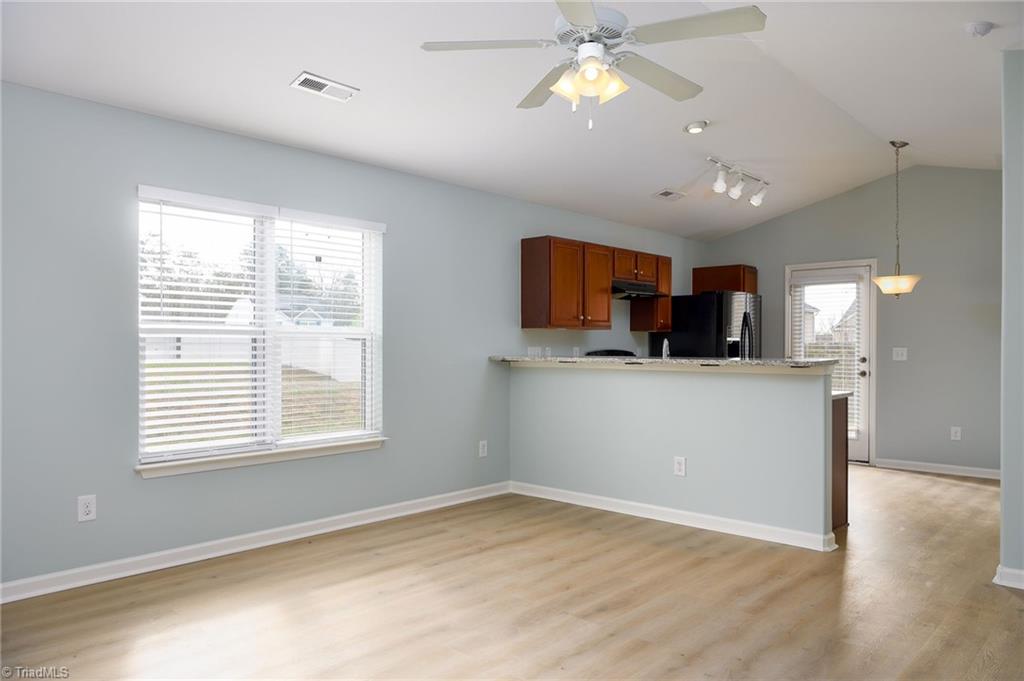 1150 Red Sage Road Winston-Salem, NC 27127 - Photo 4 of 21 Open concept living and kitchen areas! Freshly painted and new flooring throughout!