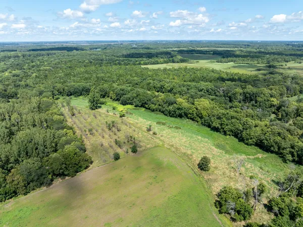 a view of a big yard with lots of green space and mountain view