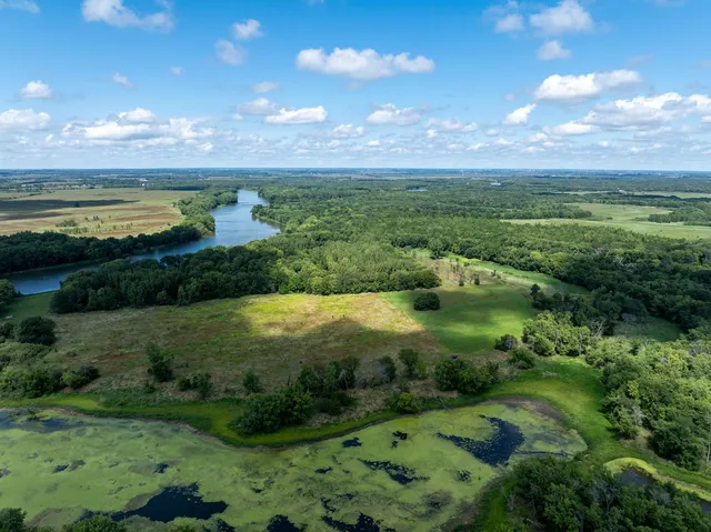 a view of a lake with a yard