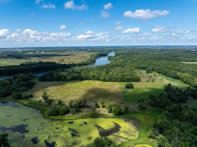 a view of a big yard with lots of green space and mountain view