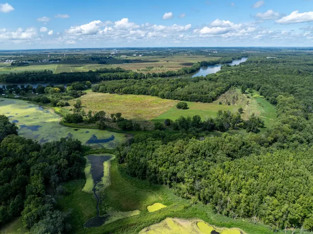 a view of a lake with a yard