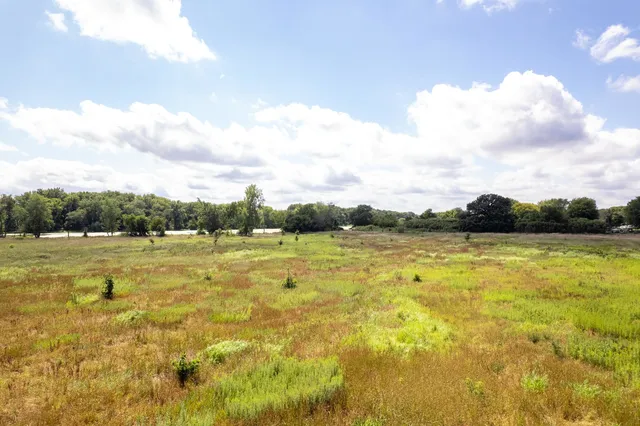 a view of a lake with a yard