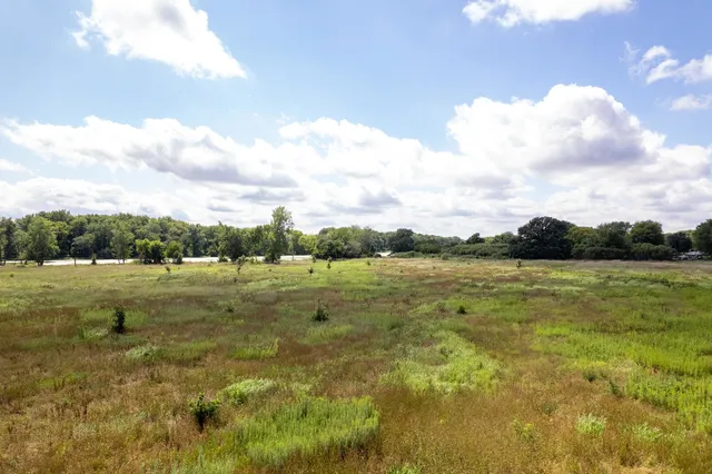 a view of a lake with a big yard