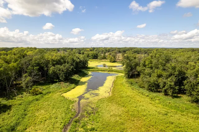 a view of a lake with a yard