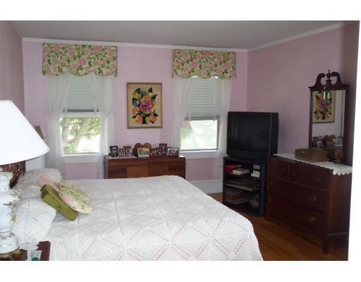 113 Morningside Road Worcester, MA 01602 - Photo 11 of 11 a bedroom with a bed and a flat screen tv