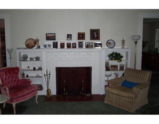 113 Morningside Road Worcester, MA 01602 - Photo 8 of 11 a living room with furniture and a fireplace
