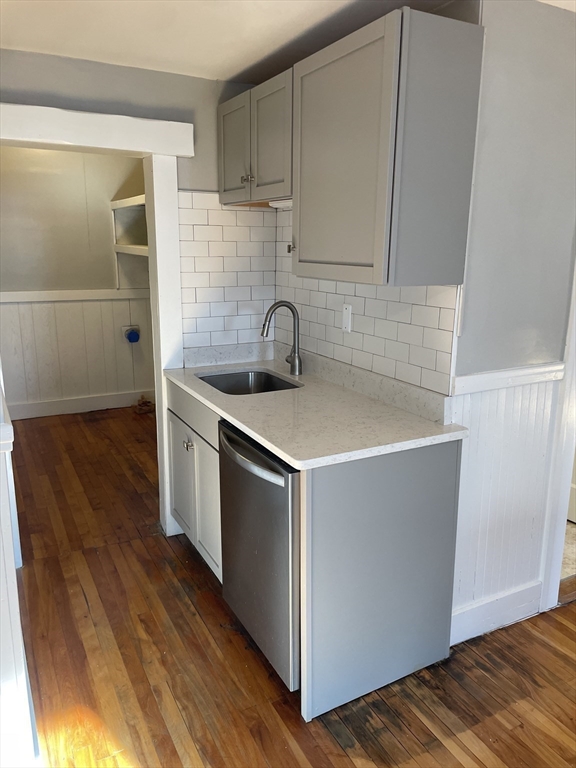 82 Brantwood Road, Unit 2 Worcester, MA 01602 - Photo 4 of 15 a kitchen with wooden cabinets and a sink