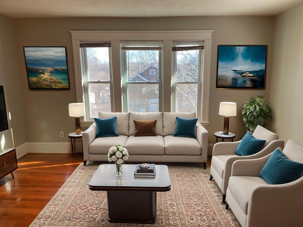 82 Brantwood Road, Unit 2 Worcester, MA 01602 - Photo 6 of 15 a living room with furniture and a flat screen tv
