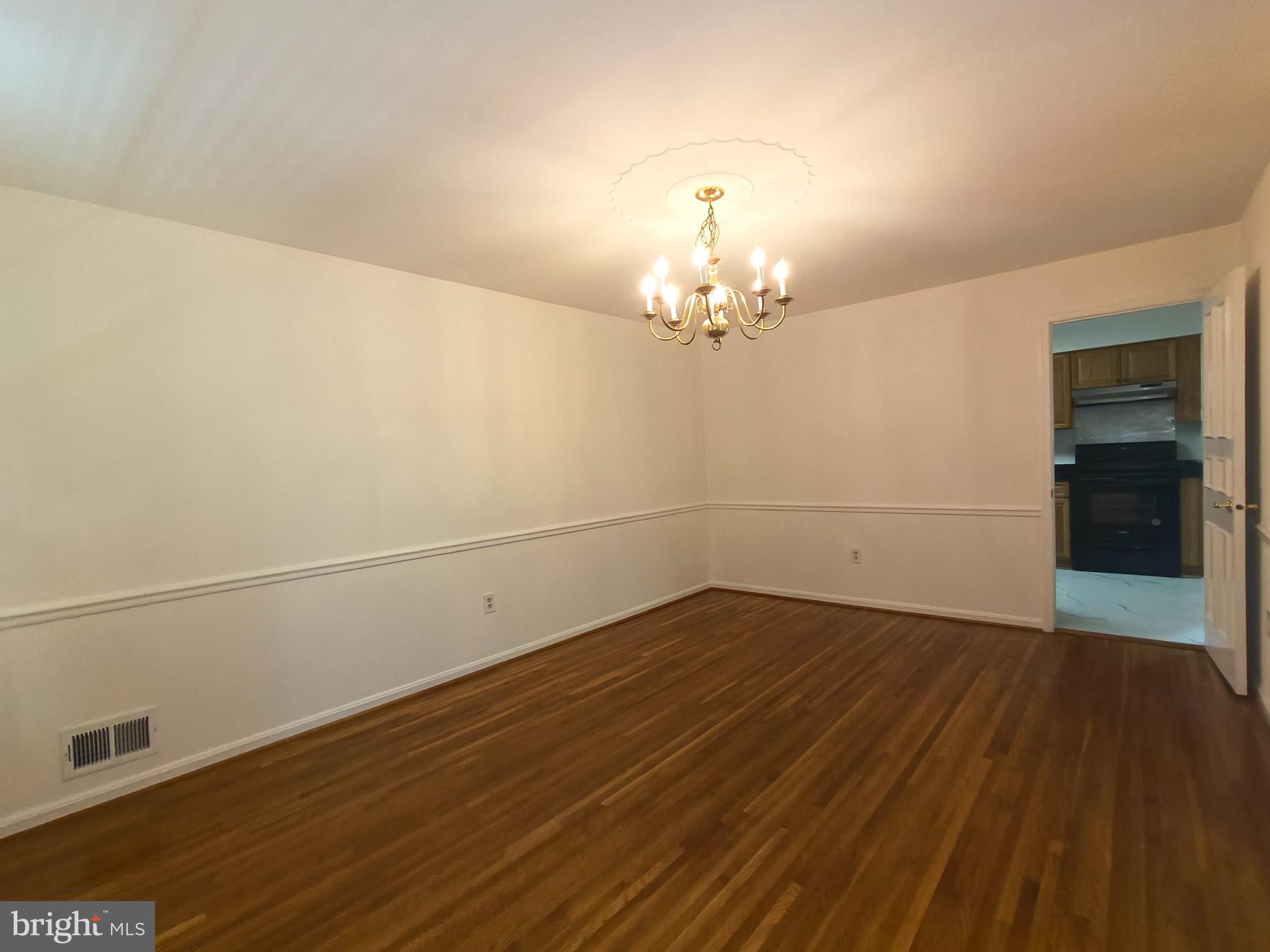 8835 Tuckerman Lane Potomac, MD 20854 - Photo 13 of 46 wooden floor in a empty room