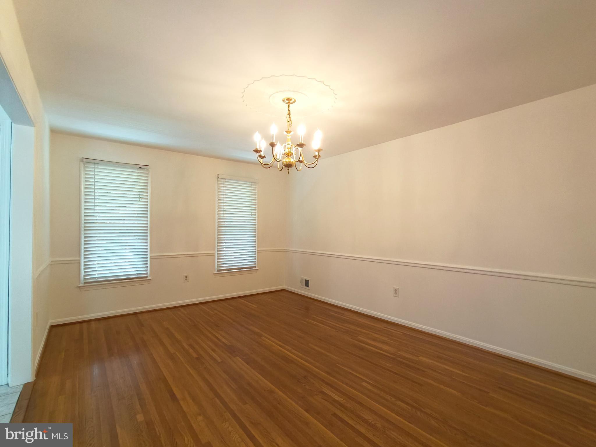 8835 Tuckerman Lane Potomac, MD 20854 - Photo 17 of 46 a view of empty room with wooden floor and fan