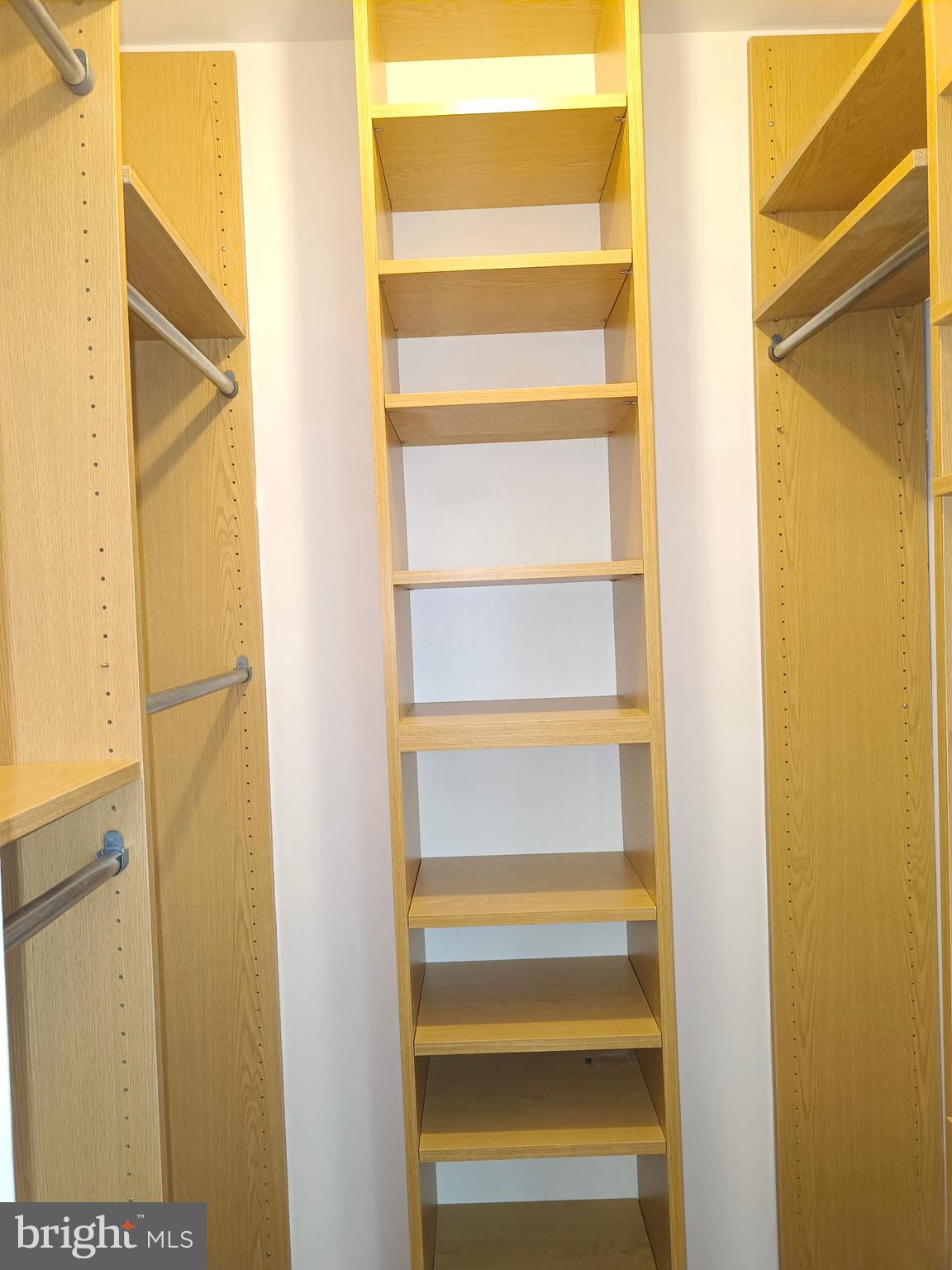 8835 Tuckerman Lane Potomac, MD 20854 - Photo 30 of 46 a view of walk in closet with empty racks