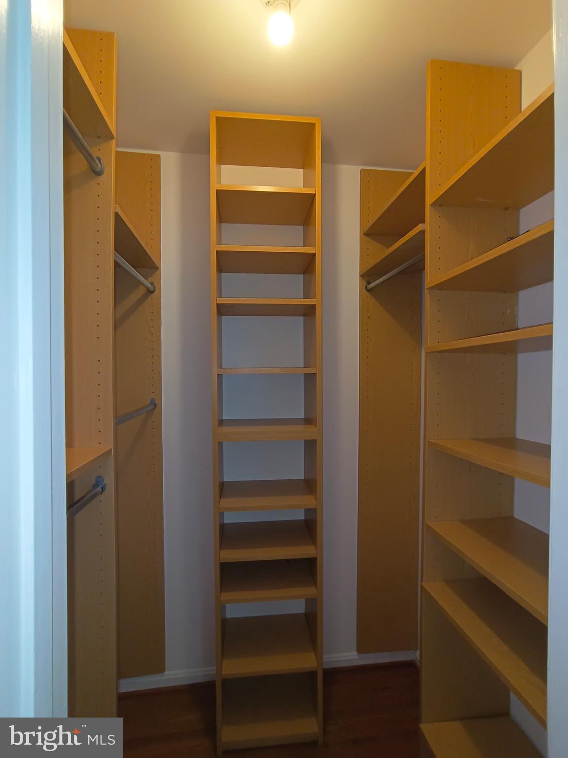 8835 Tuckerman Lane Potomac, MD 20854 - Photo 31 of 46 a view of walk in closet with empty racks
