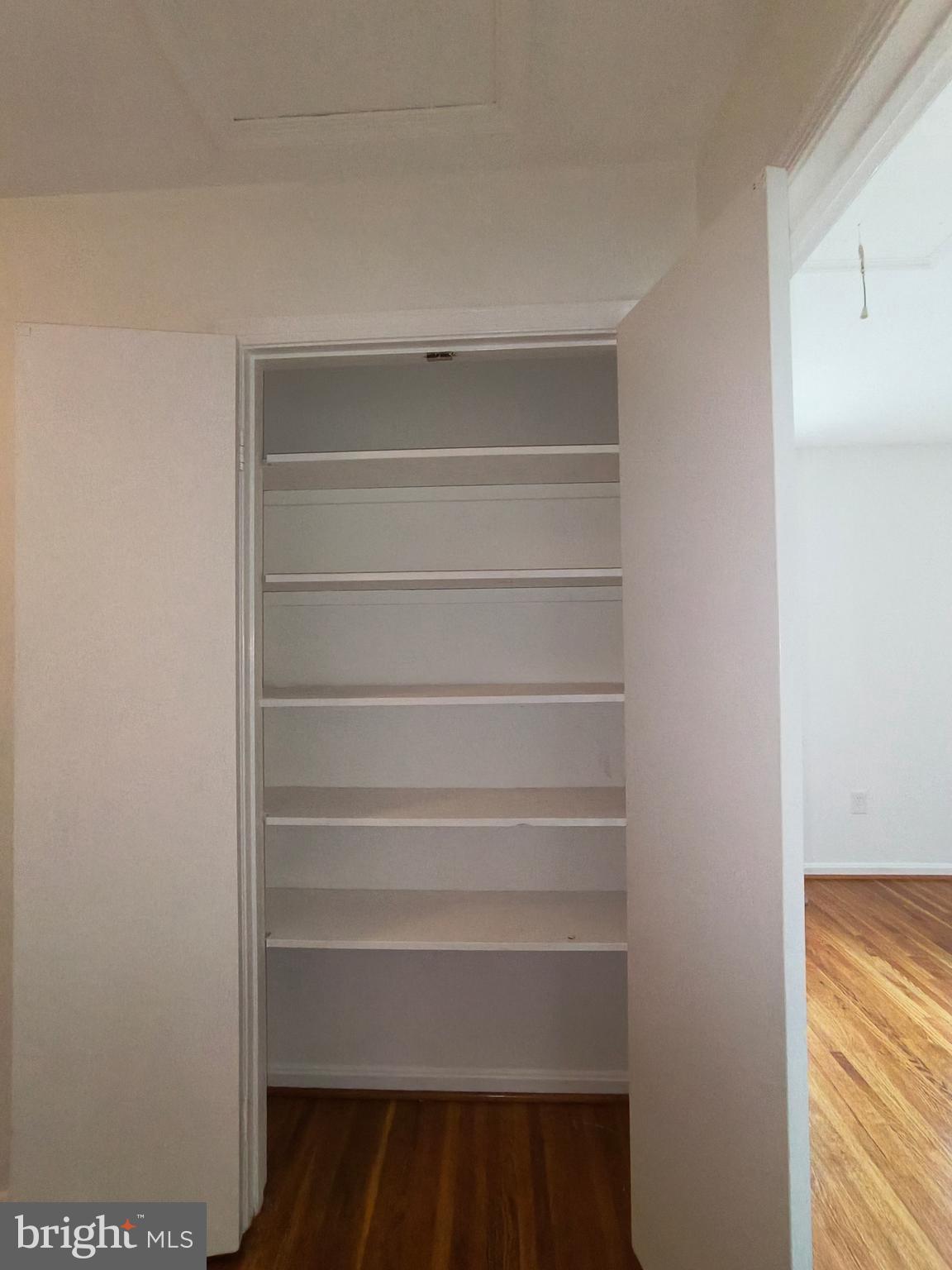 8835 Tuckerman Lane Potomac, MD 20854 - Photo 32 of 46 a view of walk in closet with empty racks