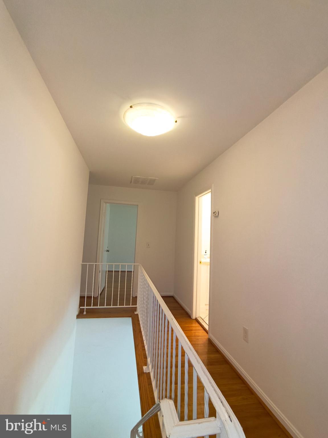 8835 Tuckerman Lane Potomac, MD 20854 - Photo 33 of 46 a view of a hallway with staircase