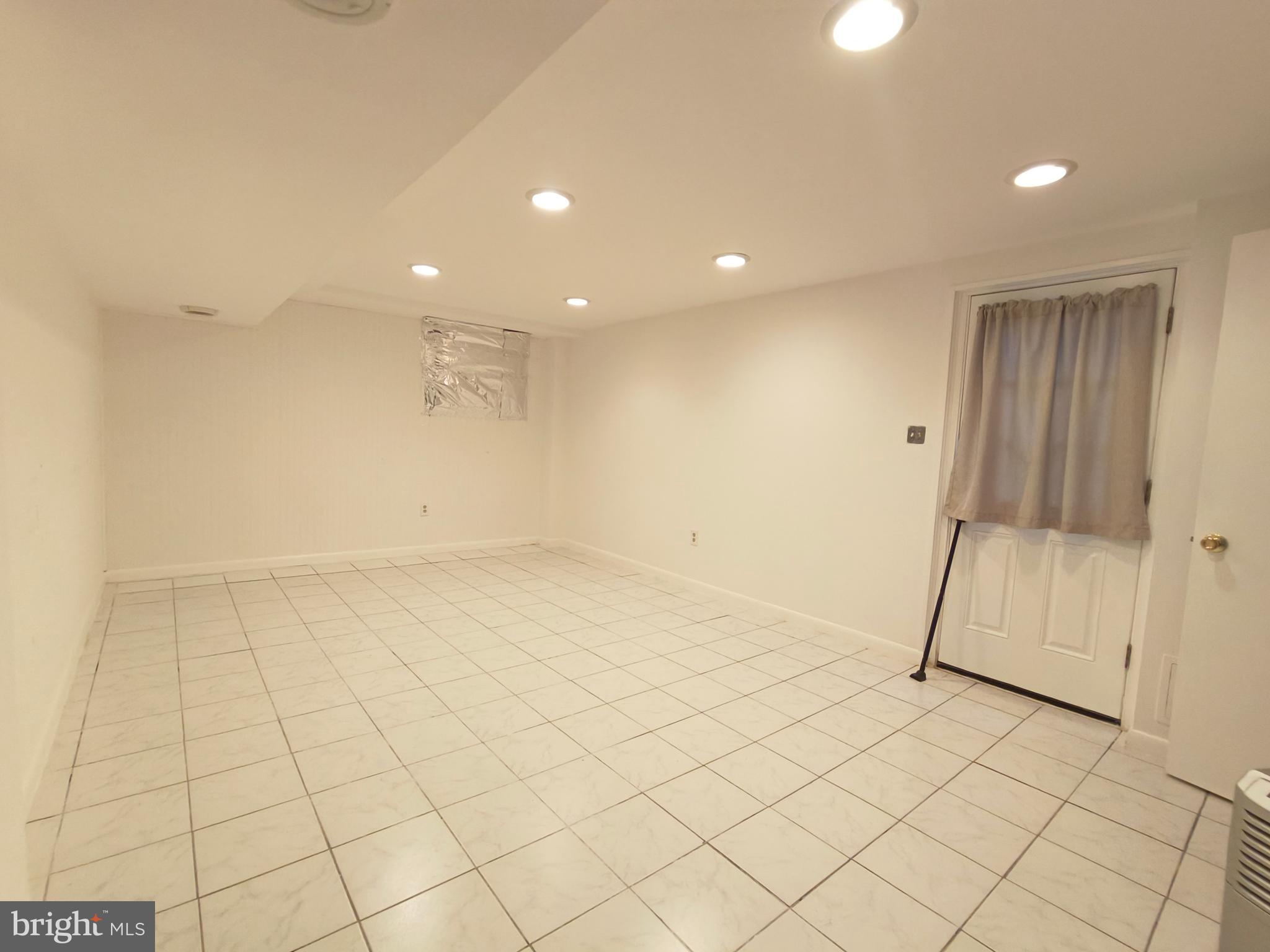 8835 Tuckerman Lane Potomac, MD 20854 - Photo 40 of 46 an empty room with garage